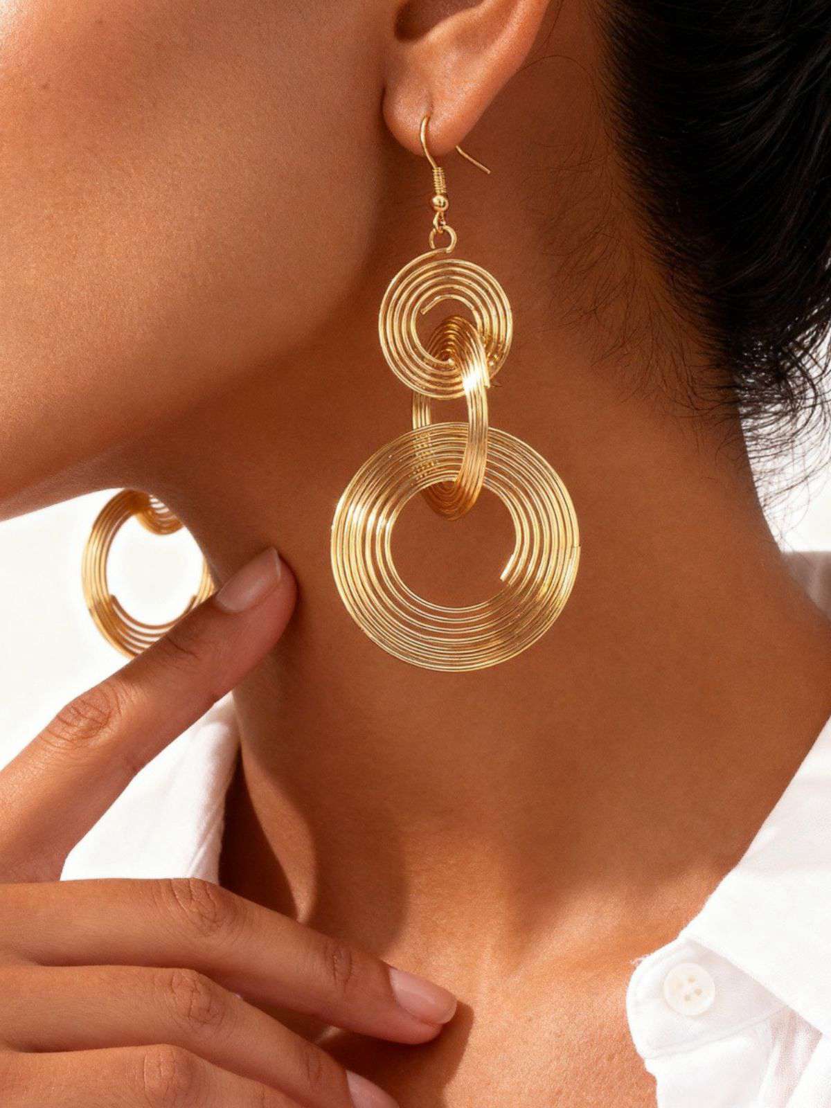 Boucles d'oreilles vintage en alliage doré à spirale exagérée