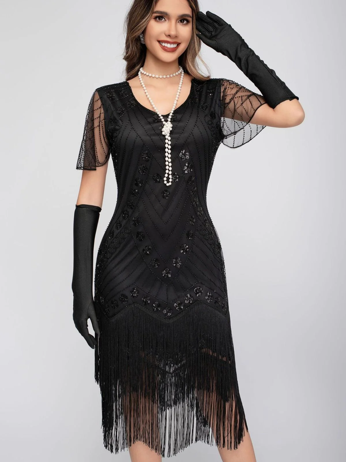 Robe de charleston manches courtes paillettes et franges des années 1920